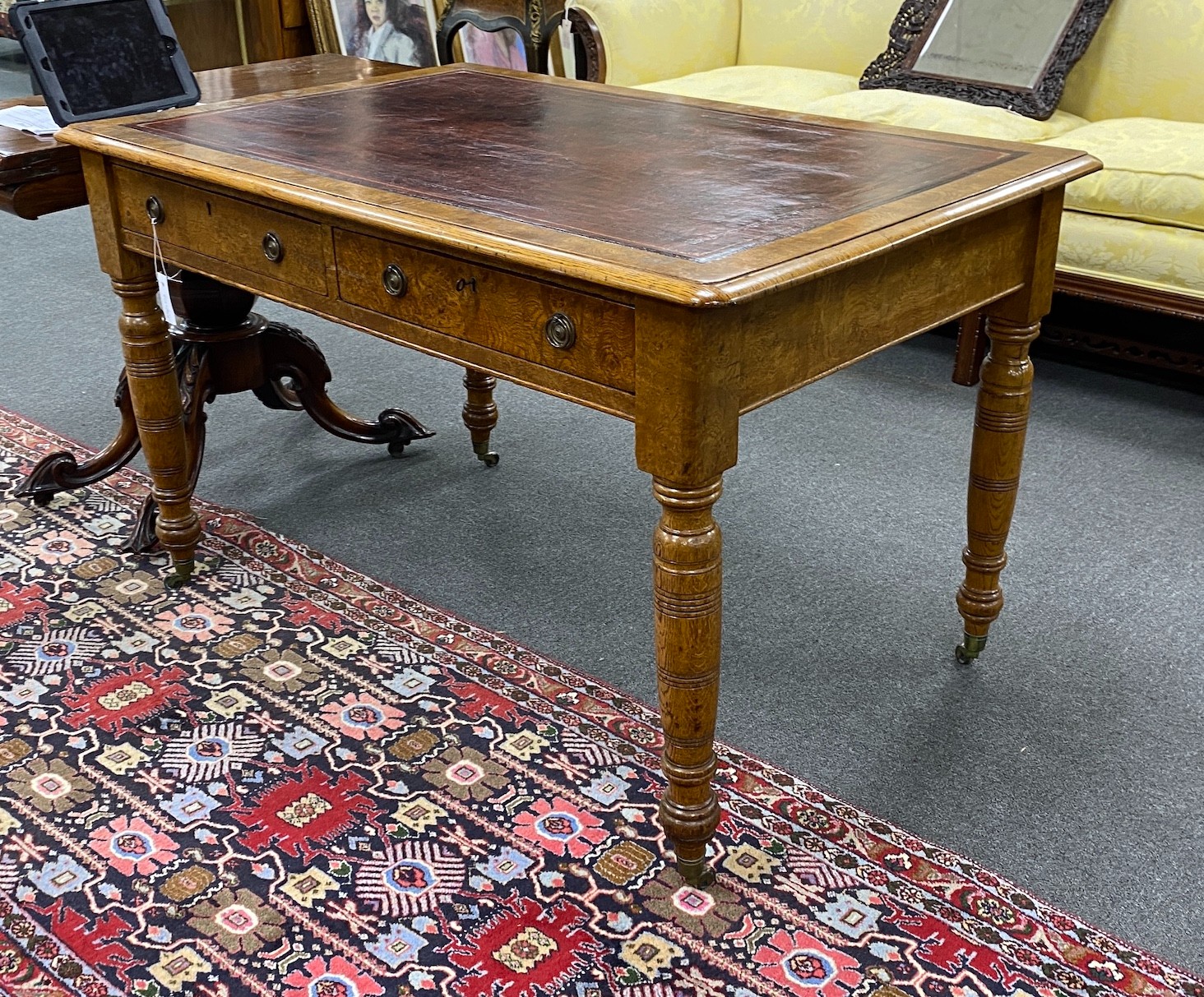 A Victorian oak and pollard oak writing table fitted two drawers opposed by dummy drawers width 120cm, depth 78cm, height 76cm.